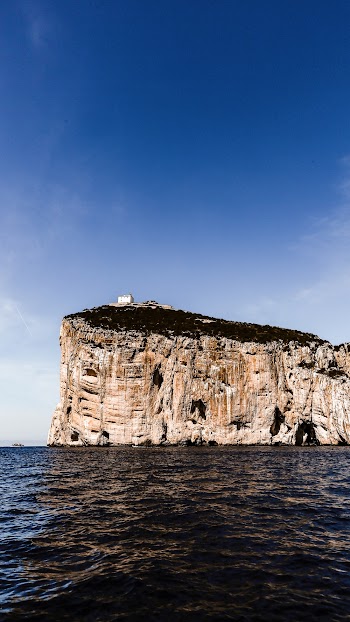 Beige Cliff Beside Body of Water