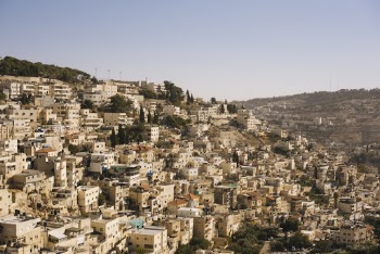 Beige Concrete Buildings on High Ground
