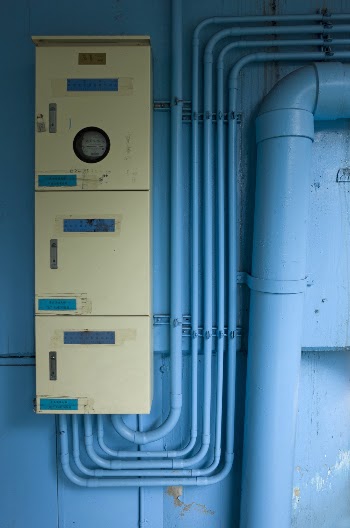 Beige Control Panel Board on Blue Wall