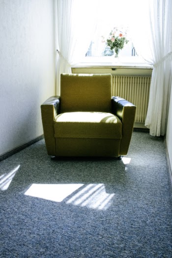 Beige Fabric Sofa Near White Window With Bundle of Flower during Daytime