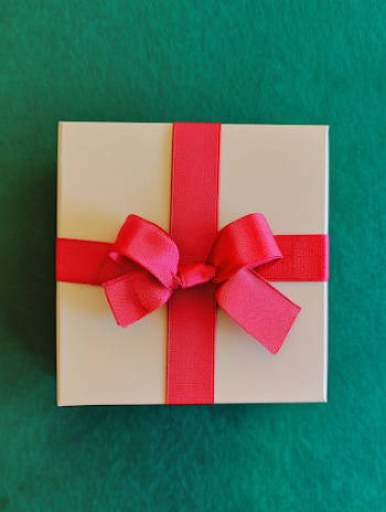 Beige Gift Box with Red Ribbon Bow