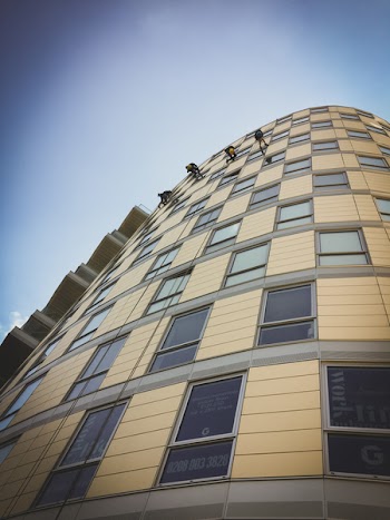Beige High Rise Building Under Blue Sky