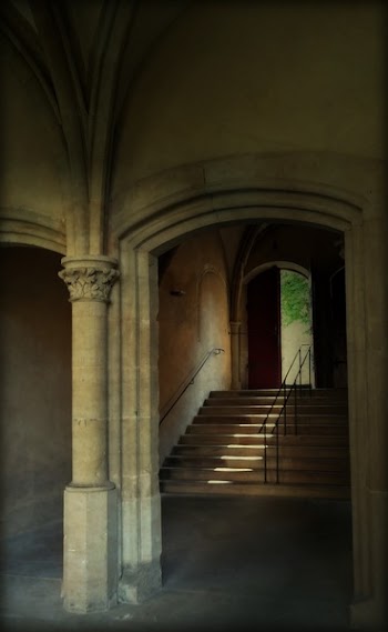 Beige Stone Stairway by Brown Door