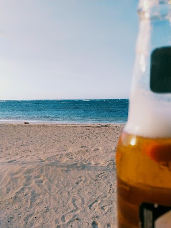 Beverage Bottle on Seashore