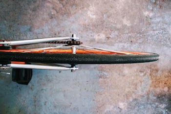 bicycle wheel on gray surface