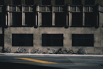 Bikes Parked Near Stone Building