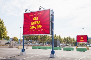 Billboard mockup at parking lot Free Psd