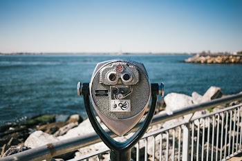 Binoculars Looking At Ocean