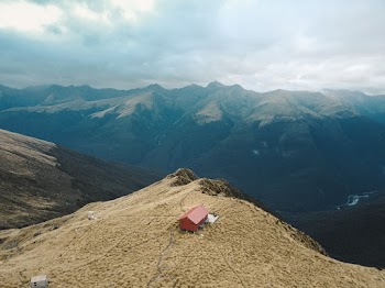 Bird's Eye View of a Red House on a Mountain