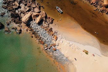 Bird's Eye View Of Boat Beside Boulders