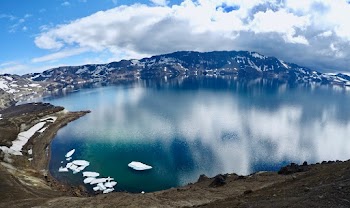 Bird's Eye View Of Body Of Water Under White Clouds