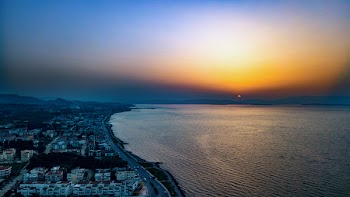 Bird's Eye View of City Near Ocean During Dawn