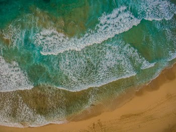 Bird's Eye View of Waves Rushing To The Shore
