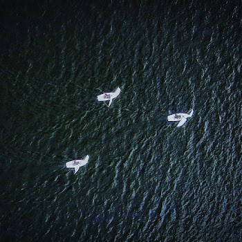 Bird's-eye View Photo of Three White Boats on Body of Water