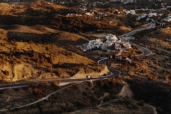 Bird's Eye View Photograph of Curvy Asphalt Road