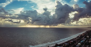 Bird's Eye View Photography of Body of Water Beside Houses
