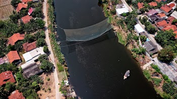 Bird's Eye View Photography of River in Between Houses