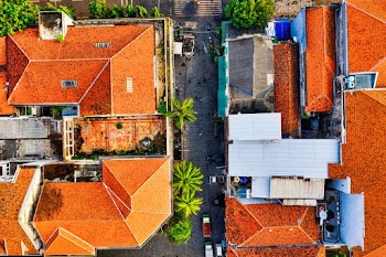 Bird's-eye View Photography of Two Orange RoofedHouses