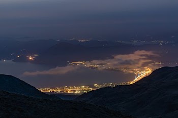 bird's eye photography of city and mountain
