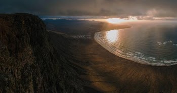 bird's eye view of seashore near cliff