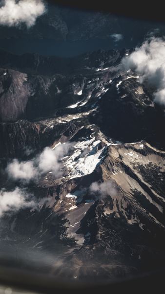 bird's eye view of snow-covered mountains during daytime