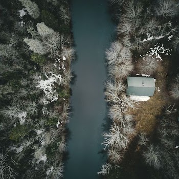 bird's eye view photo of gray house near river
