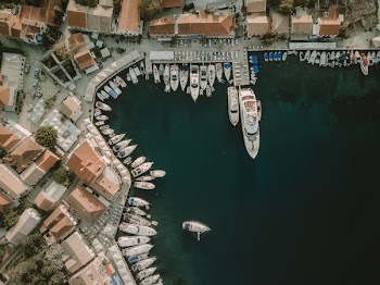 bird's eye view photography of body of water and cityscape