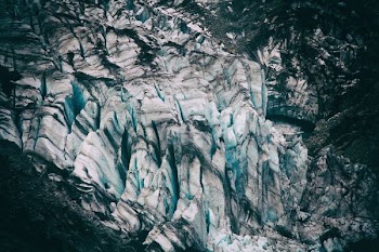 bird's eyeview photo of alp mountains covered in snow