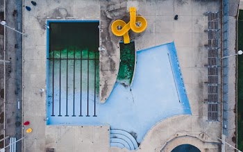 Birds Eye View Of Closed Pool With Waterslide