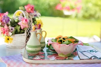 Biscuits on White Ceramic Bowl Beside White Ceramic Container on Silver and White Tray