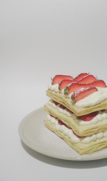 Biscuits With Cream and Sliced Strawberry Toppings