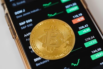Bitcoin on Smartphone Displaying Stock Market Data