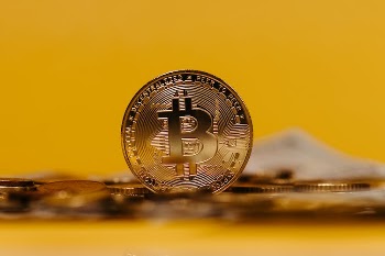 Bitcoin on Yellow Background