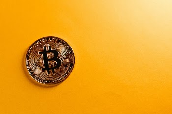 Bitcoin on Yellow Background