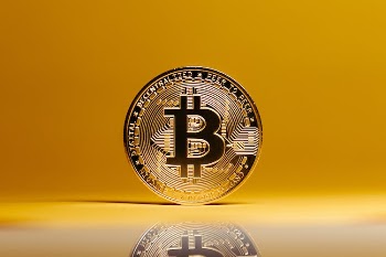 Bitcoin on Yellow Studio Background