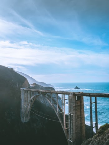 Bixby Creek Bridge, also known as Bixby Canyon Bridge, on the Big Sur coast of California, is one of the most photographed bridges in California due to its aesthetic design, “graceful architecture and magnificent setting”. It is a reinforced concrete open-spandrel arch bridge.