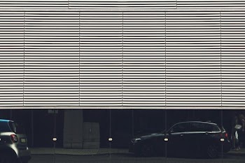 black 5-door hatchback parked on road