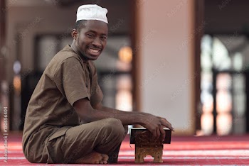 Black African Muslim Man Reading Holy Islamic Book Koran