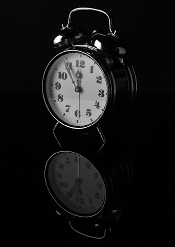 Black Alarm Clock Displaying 12:55