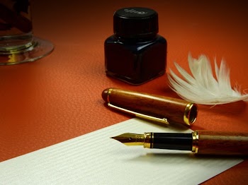 Black and Brown Fountain Pen on Ruled Paper