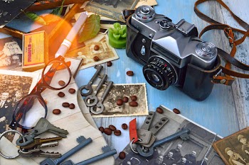 Black and Gray Camera Near Gray Skeleton Keys
