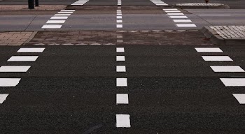 black and gray concrete road with white lanes