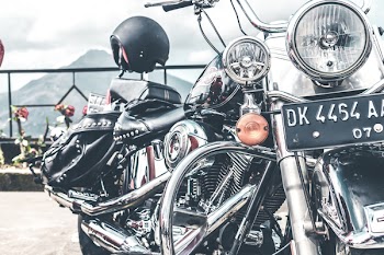 Black and Gray Cruiser Motorcycle Parked Near Railings