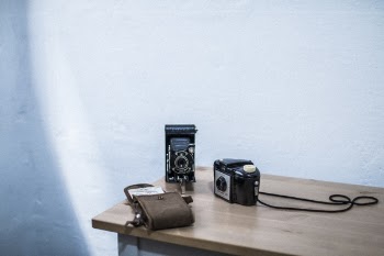 Black and Gray Folding Camera on Table