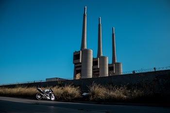 Black and Gray Sport Bike Parked Near Grasses