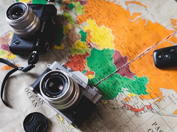 Black and Silver Dslr Cameras on Map