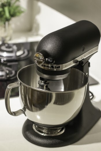 Black and Silver Kitchenaid Stand Mixer on Top of White Surface