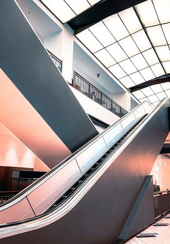 Black and White Escalator Inside Building