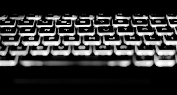 Black and White Mechanical Keyboard With White Led Lights