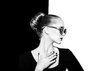 Black and White Photo of a Woman Placing Her Hand on Her Chest